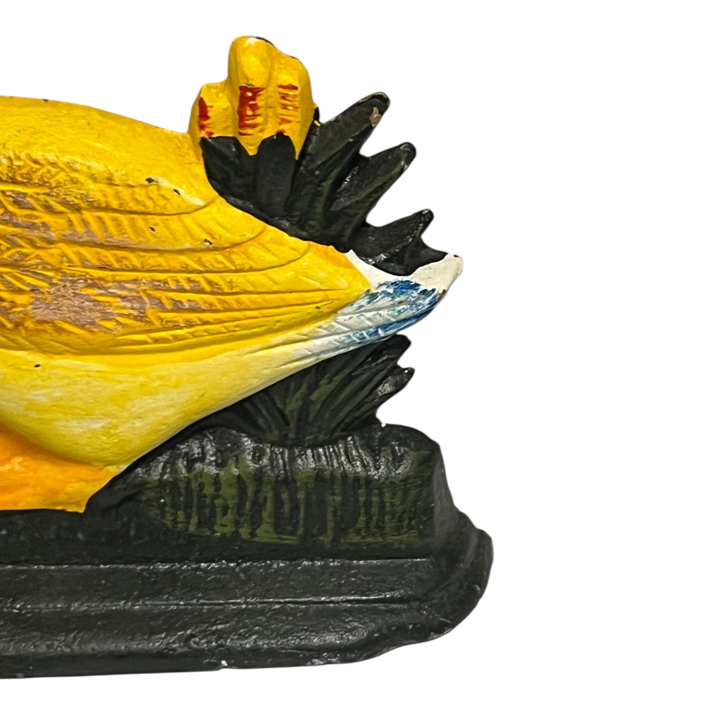 Close up of cast iron doorstop on a white background