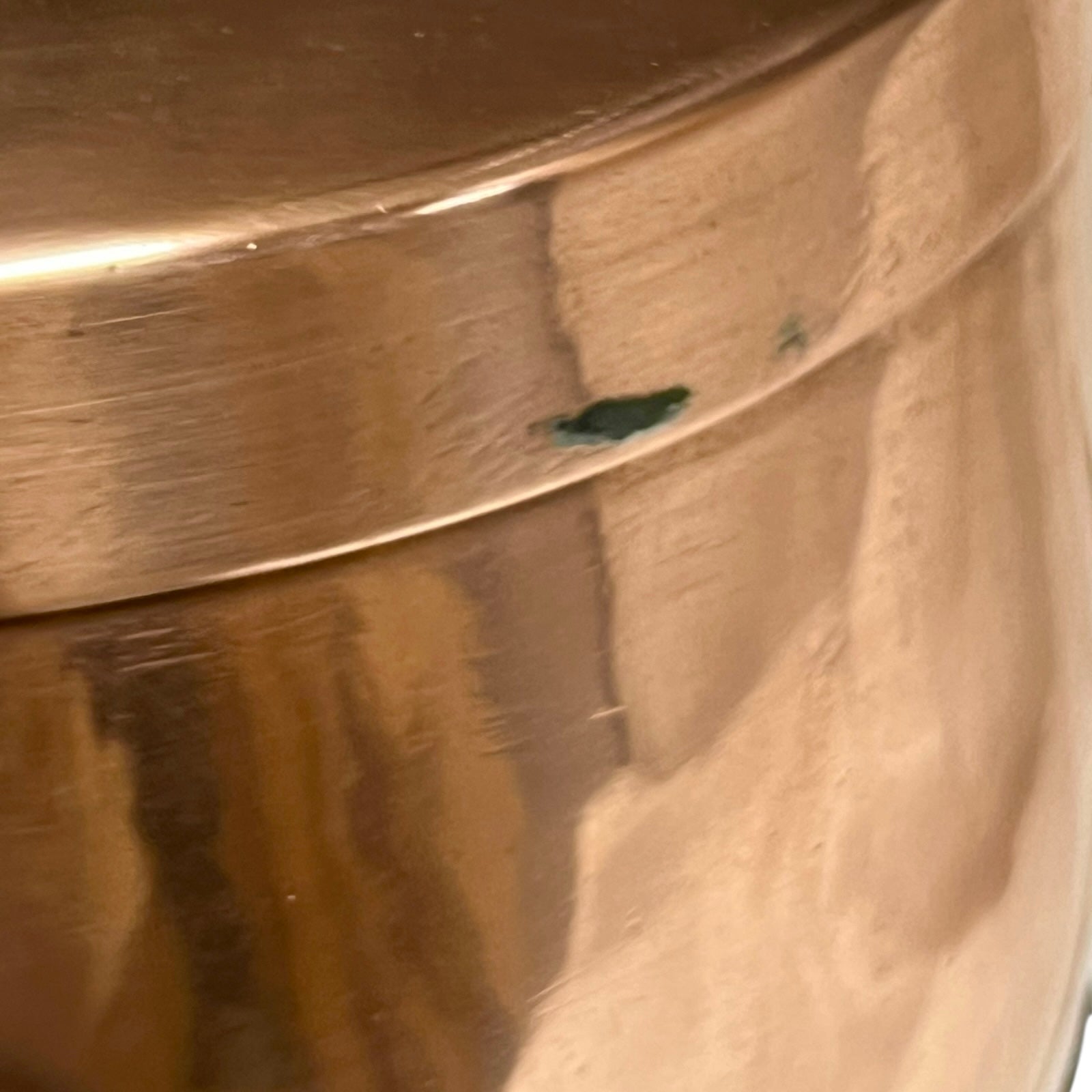 Close up of a copper cooking pot stockpot with handles on a white background
