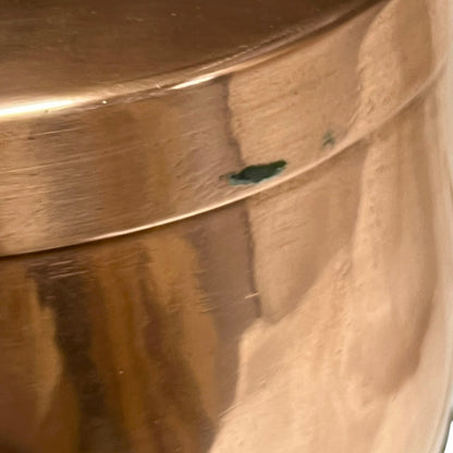 Close up of a copper cooking pot stockpot with handles on a white background