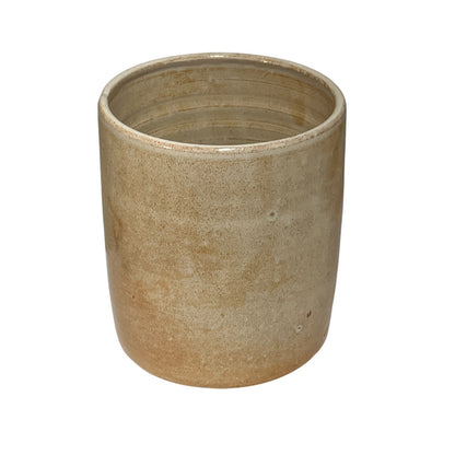 A rustic, cylindrical ceramic planter or pot with a textured, speckled finish in earthy beige and light brown tones, shown against a plain white background.