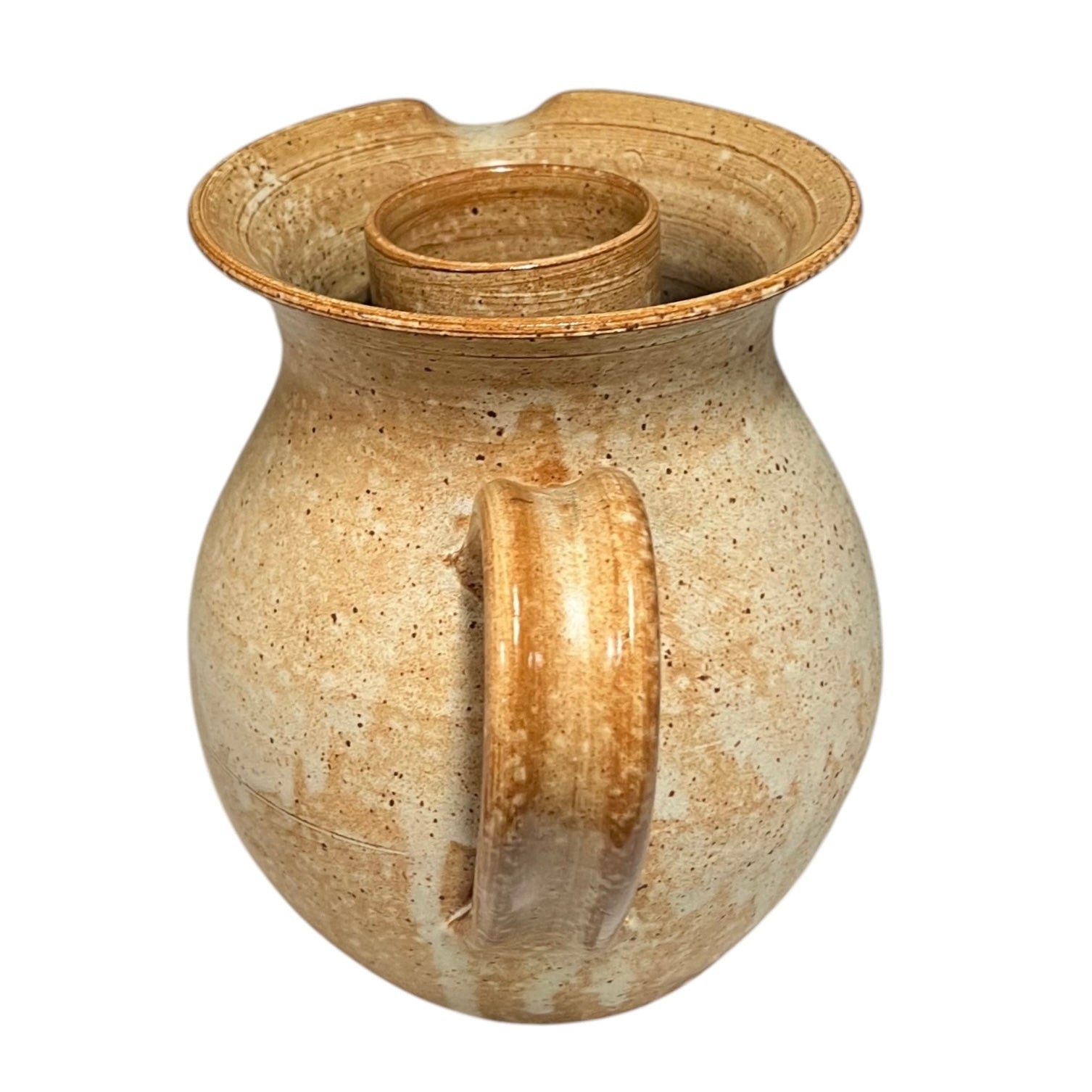 Brown ceramic jug with a handle on a white background