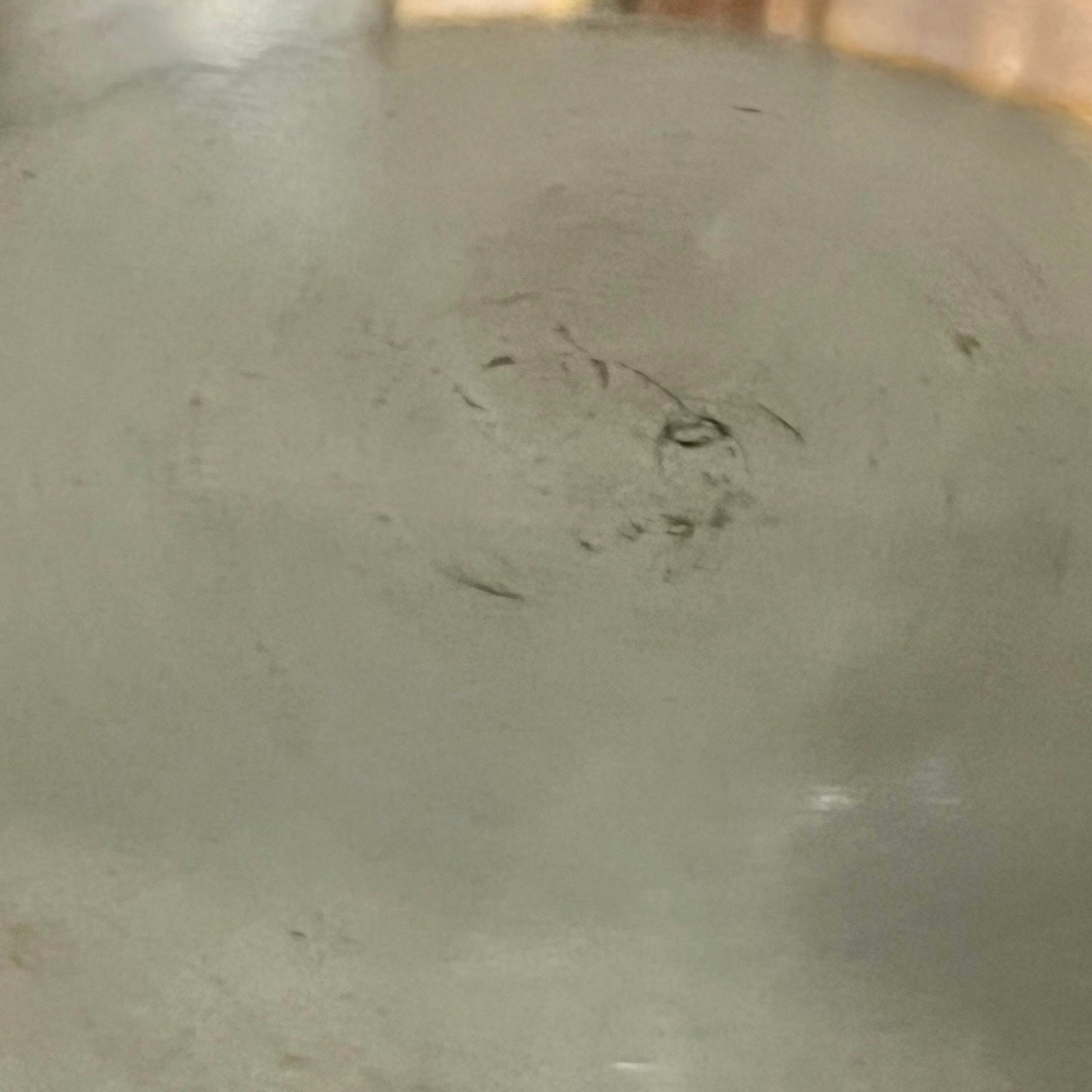 inside of copper pan with tin lining on a white background