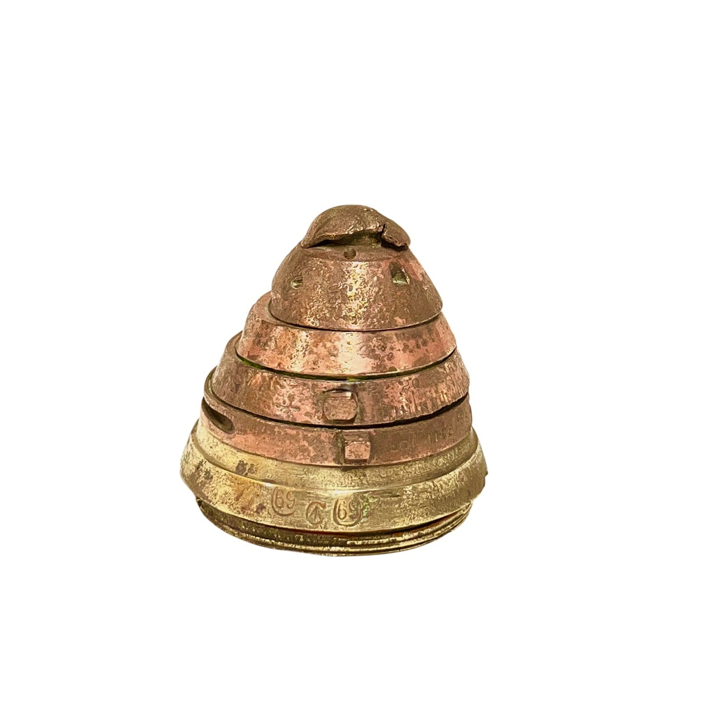 WW1 brass fuse paperweight on a white background