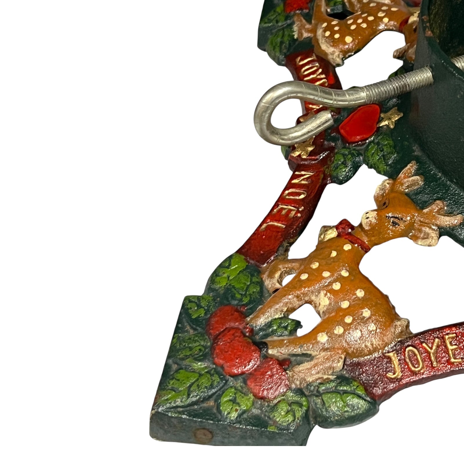 Close up of cast iron Christmas Tree holder on a white background