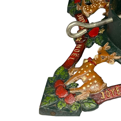 Close up of cast iron Christmas Tree holder on a white background