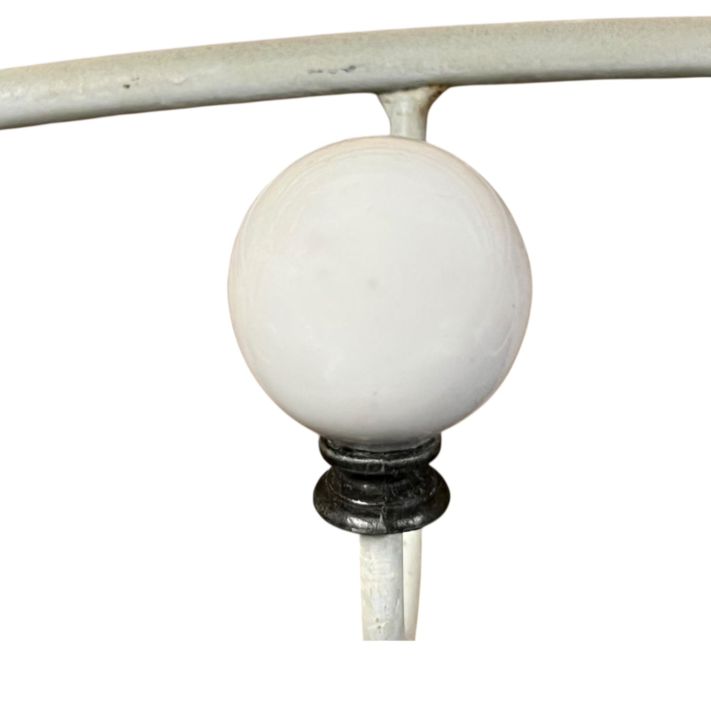 Close-up of a metal she with visible wear and tear on a white background