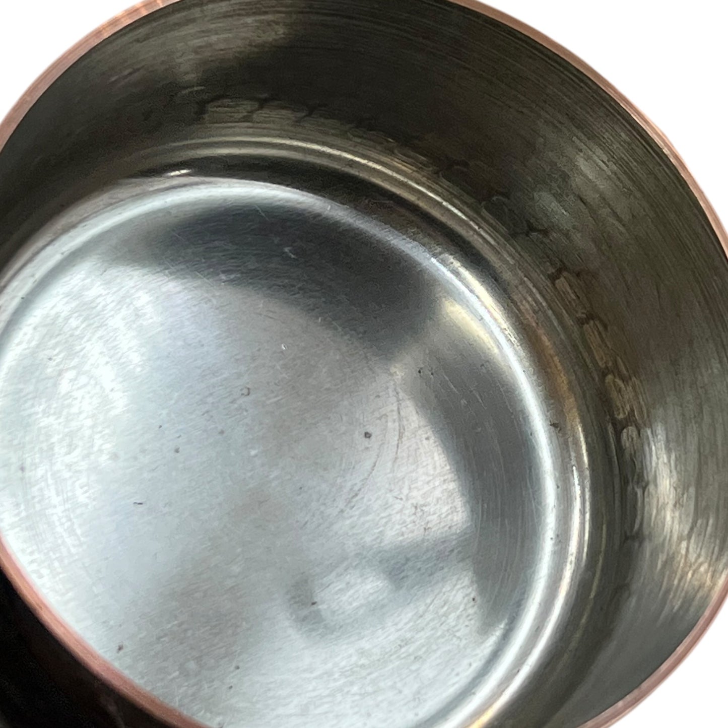 close up of copper pan tin linings