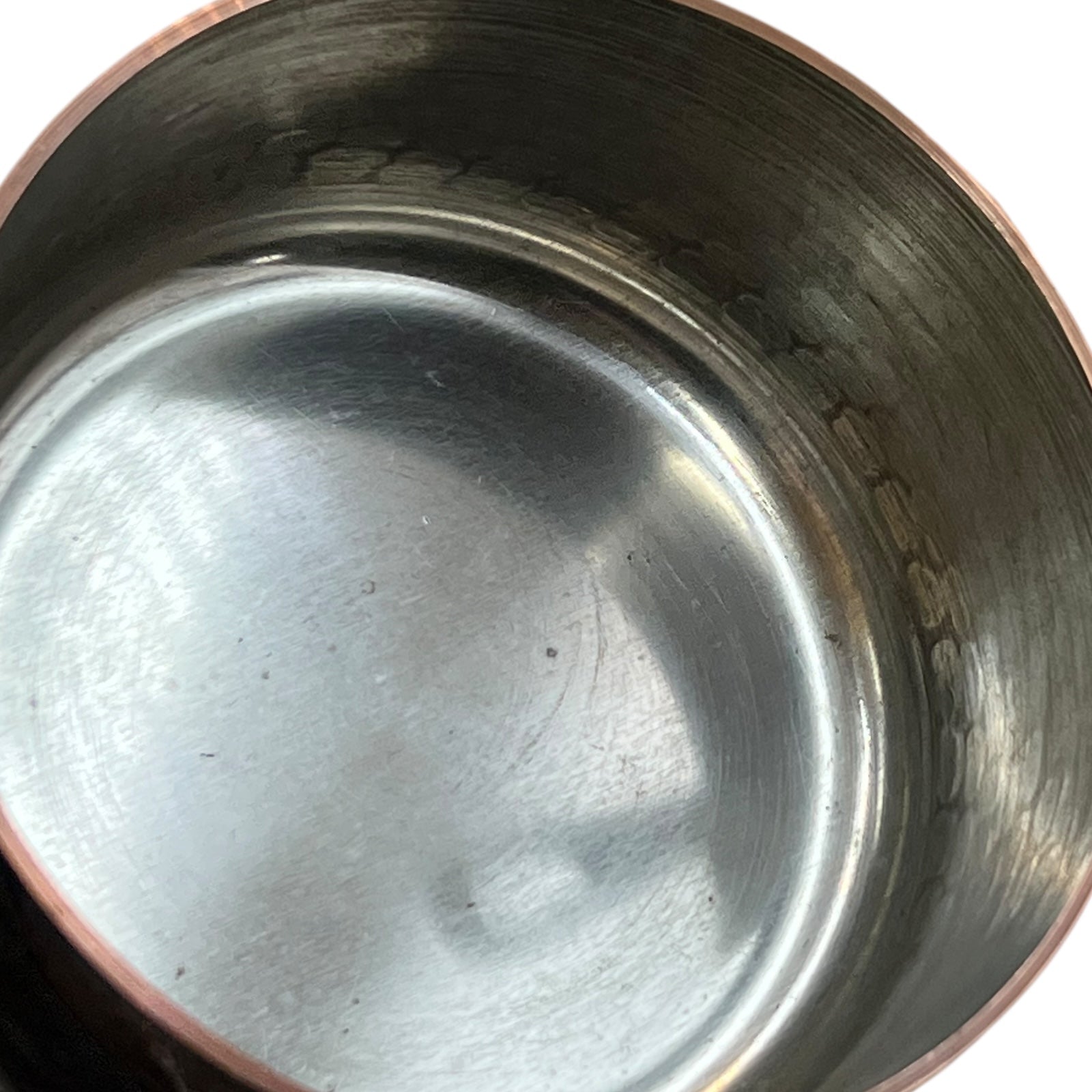 close up of copper pan tin linings