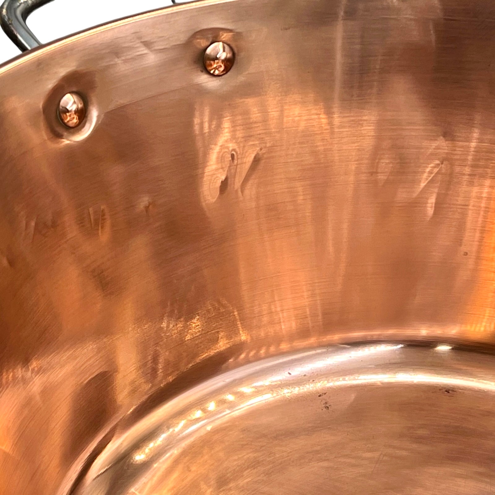 Close-up of a copper sink on a white background