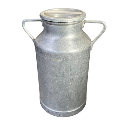 Metal milk churn on a white background