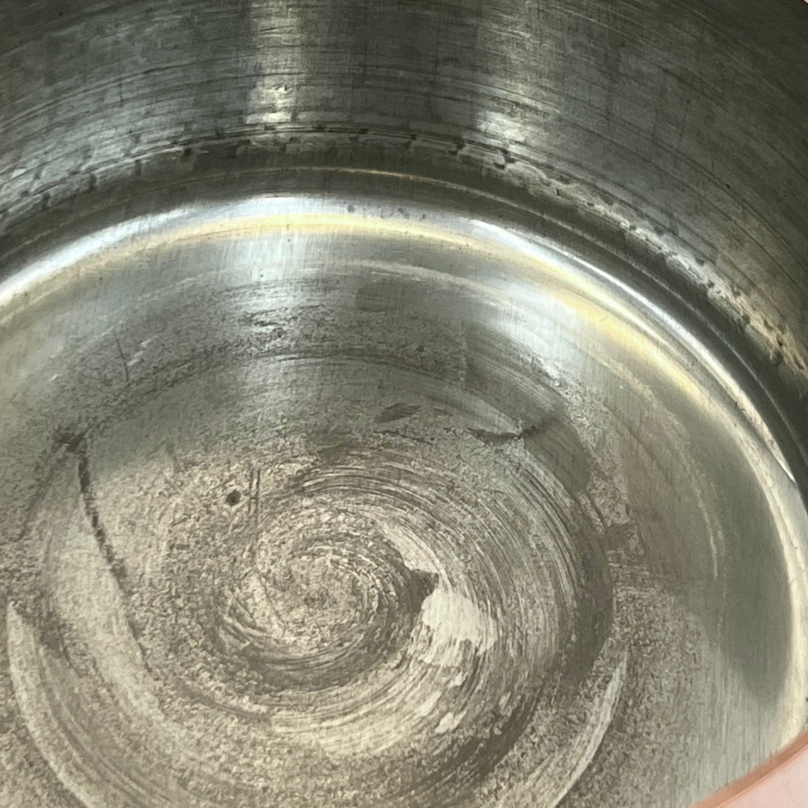 close up of copper pan tin lining