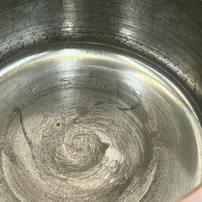 close up of copper pan tin lining
