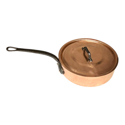 Copper pot with lid on a white background