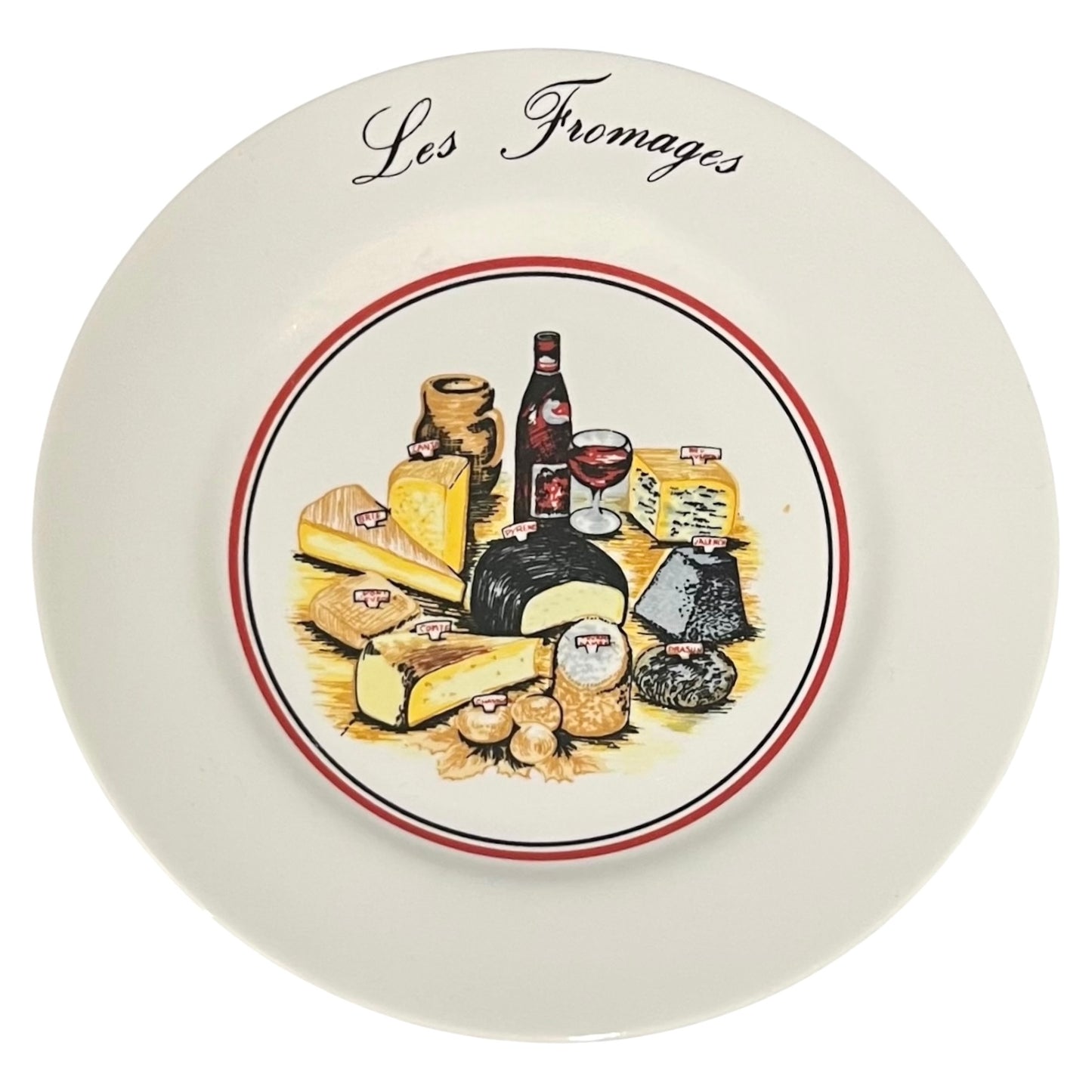 Decorative plate with illustrations of cheeses and wine, labeled 'Les Fromages'.