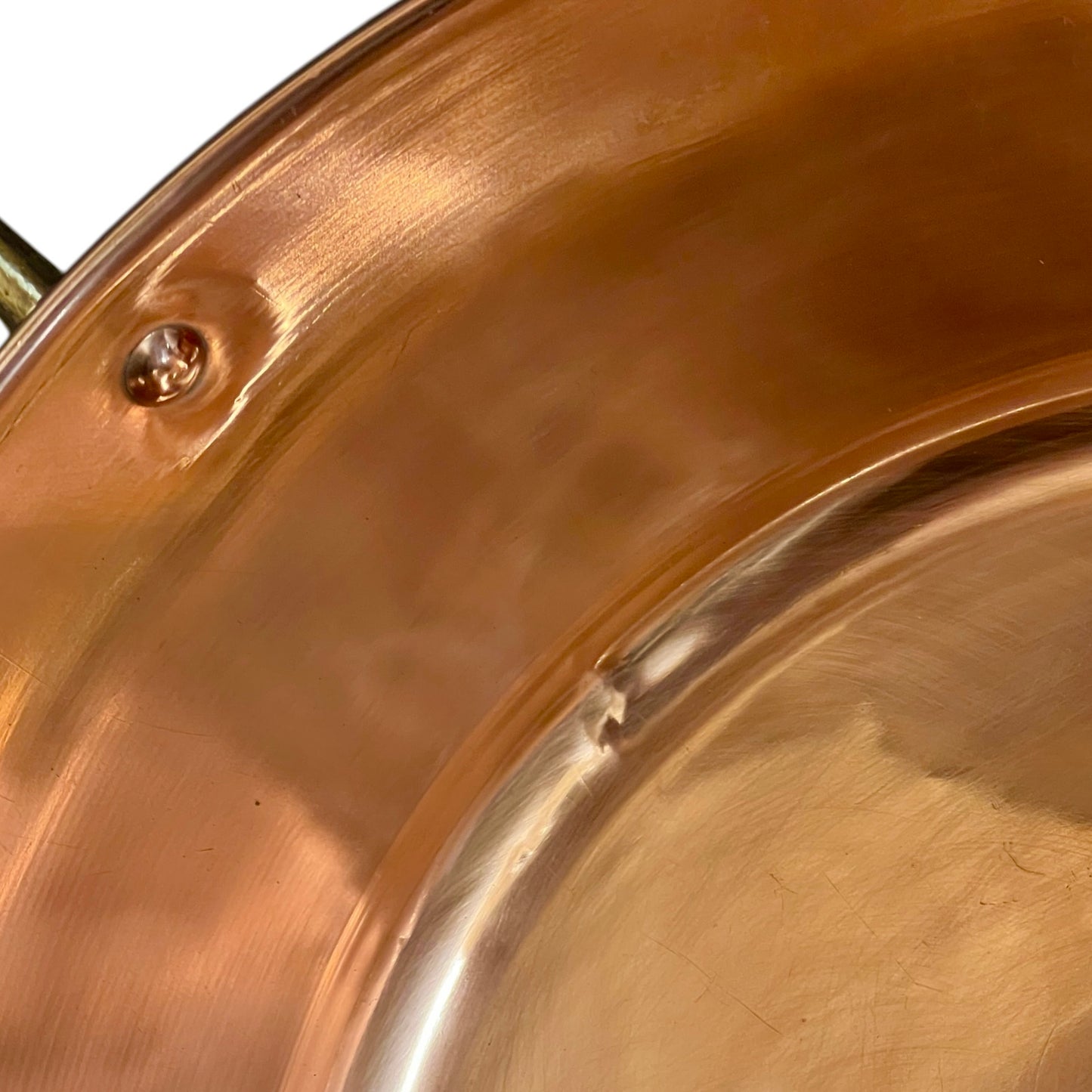Close-up of a copper sink on a white background