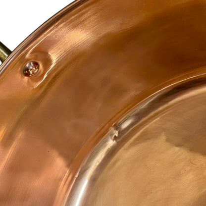 Close-up of a copper sink on a white background