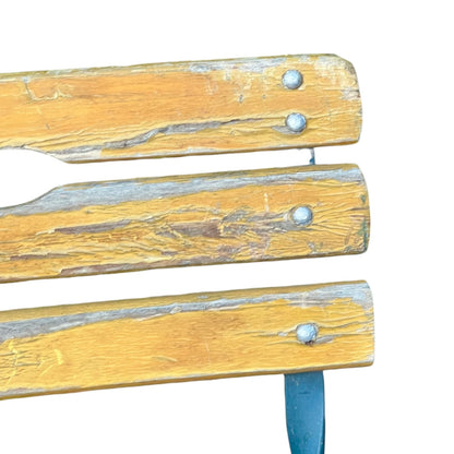 Close up of a wooden French folding chair on a white background 