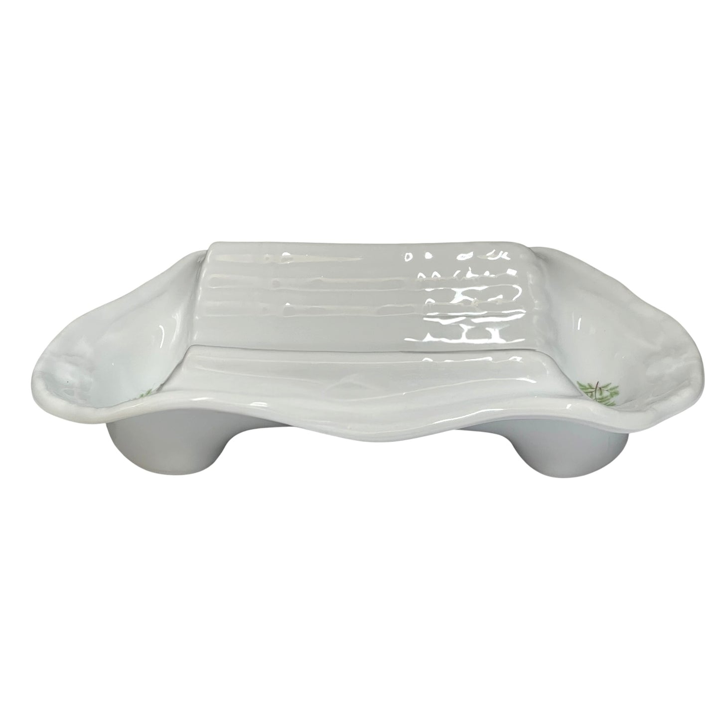 A white ceramic dish with a ribbed rectangular centre and rounded side extensions, shown on a plain white background.