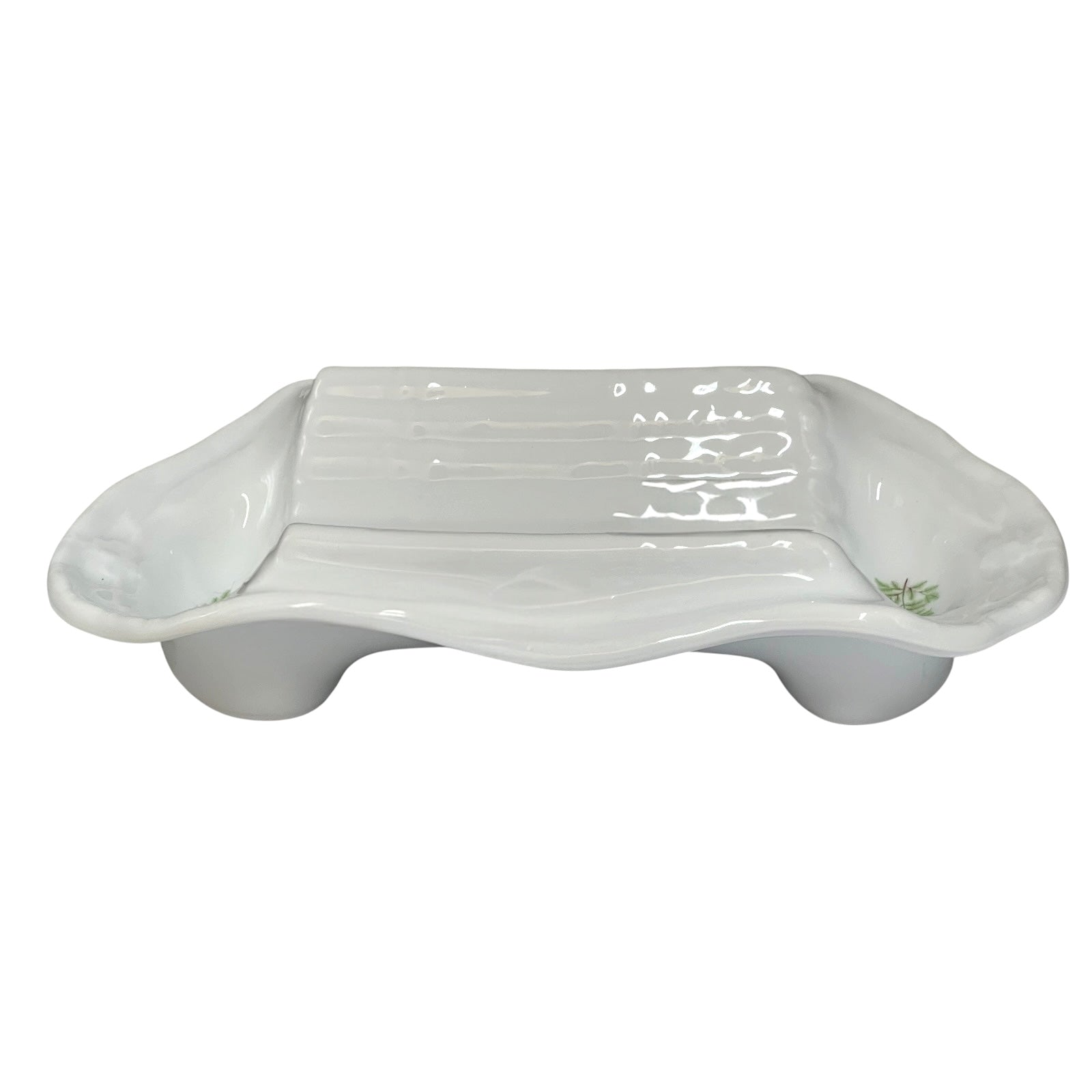 A white ceramic dish with a ribbed rectangular centre and rounded side extensions, shown on a plain white background.