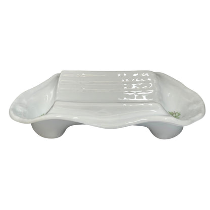 A white ceramic dish with a ribbed rectangular centre and rounded side extensions, shown on a plain white background.