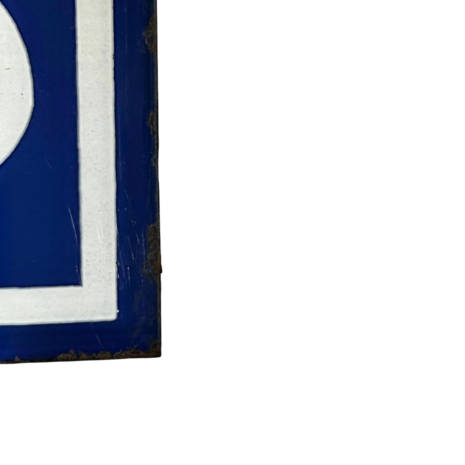Close up of a French blue and white enamel door number - corner
