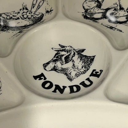 Fondue set with a cow illustration and 'FONDUE' text on a white background