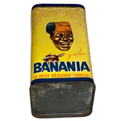 Vintage metal container with 'Banania' branding and a person holding a banana on a yellow background.
