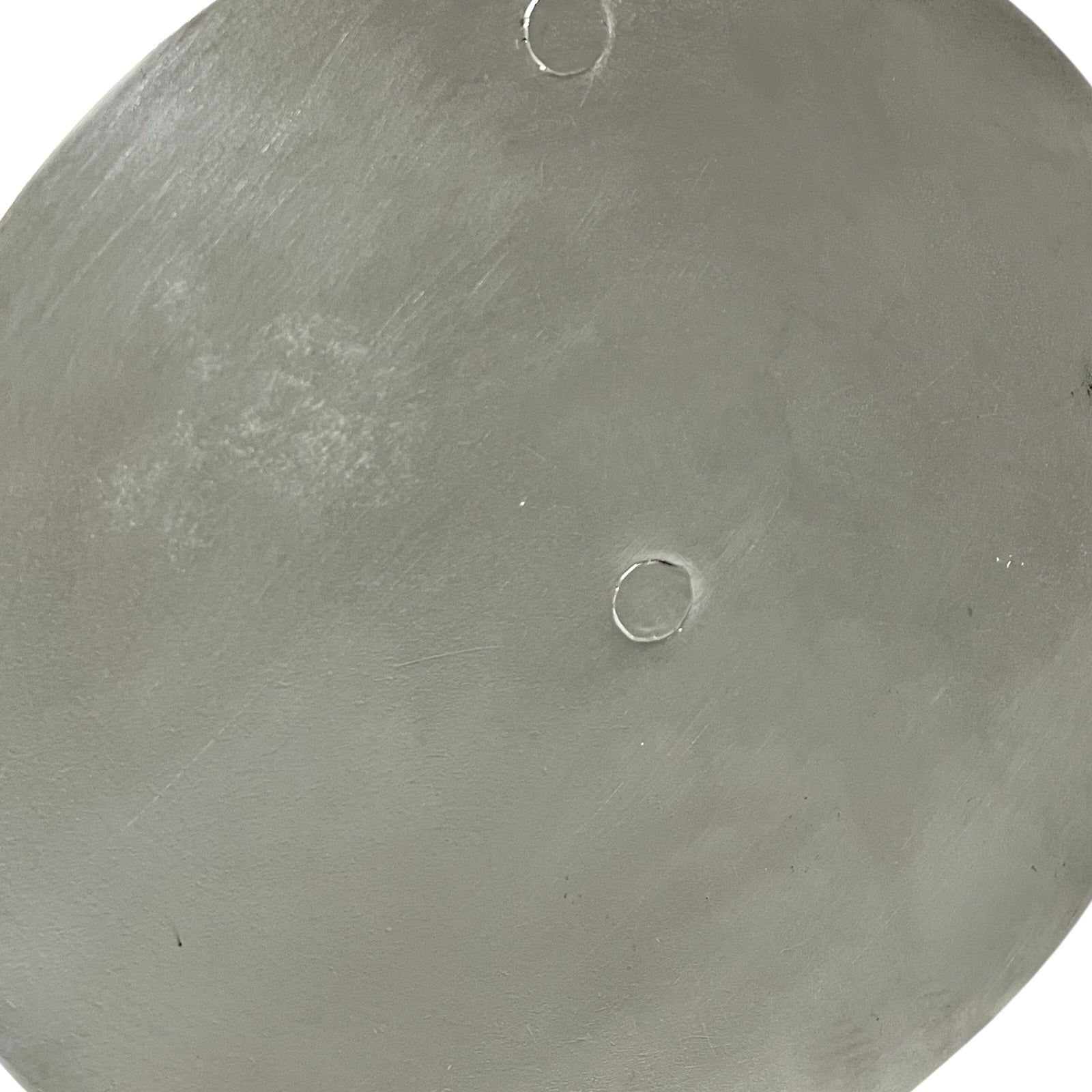 Close up French copper pan lid showing hand wiped traditional new tin lining  on a white background