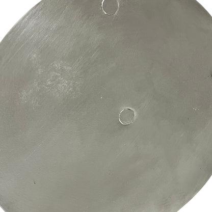 Close up French copper pan lid showing hand wiped traditional new tin lining  on a white background