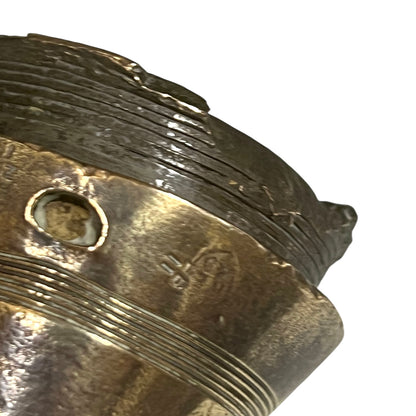 WW1 brass fuse paperweight on a white background