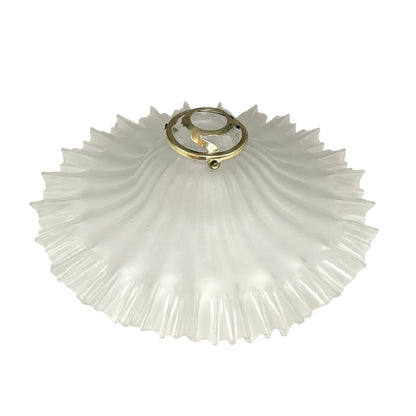 Decorative French vintage frosted glass lamp shade with a ribbed design and gold fixture on a white background