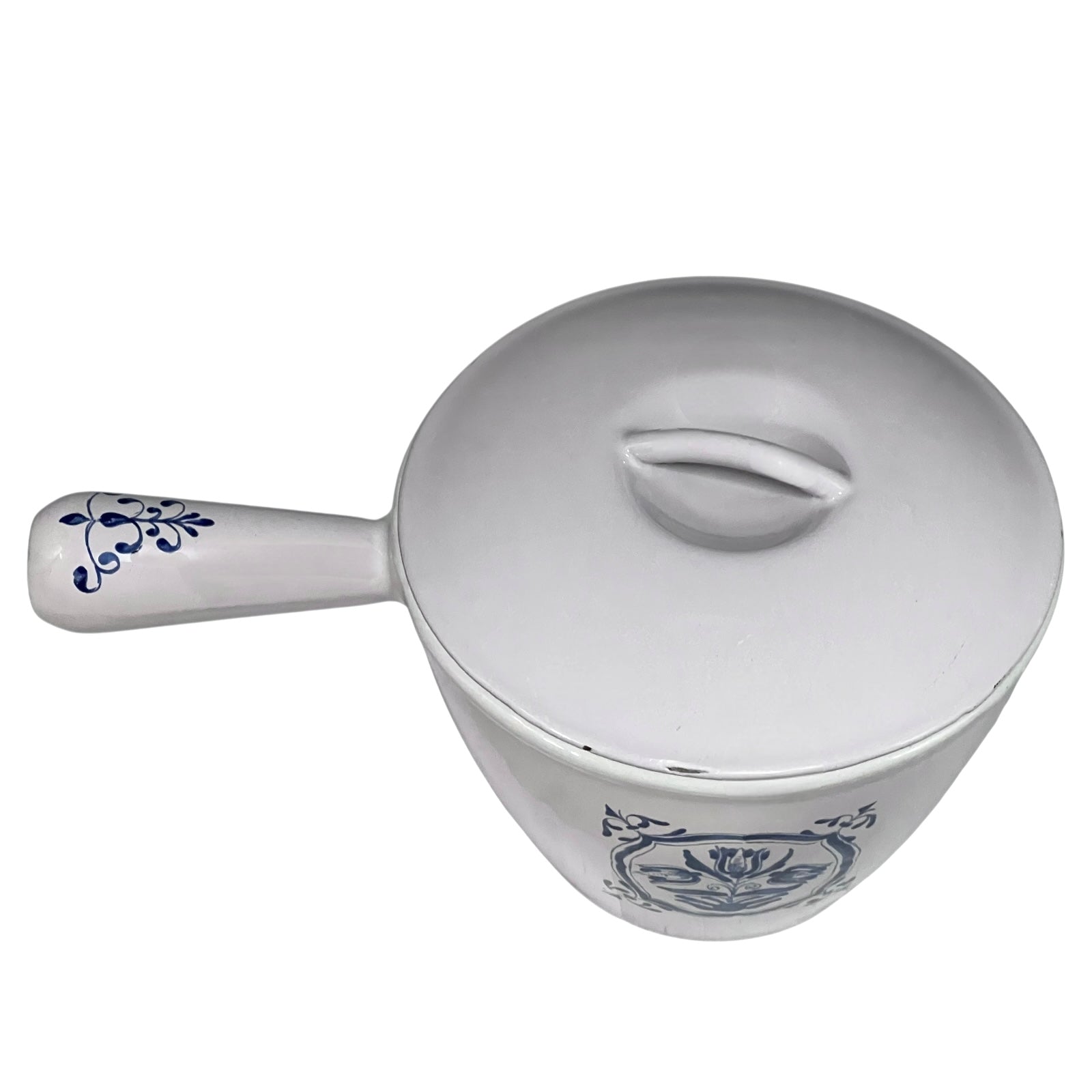 White enamelled cast iron pot with blue floral design and handle on a white background