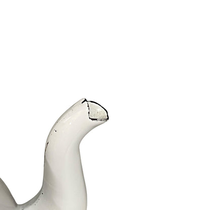 Close up of an enamel teapot on a white background