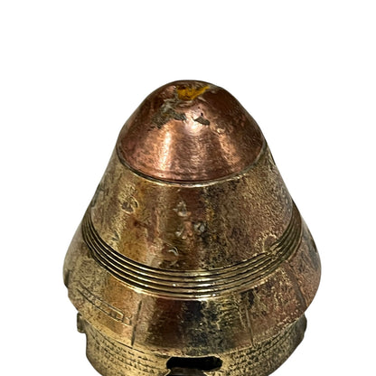 WW1 relic brass fuse number 102, ideal as a paperweight n a white background