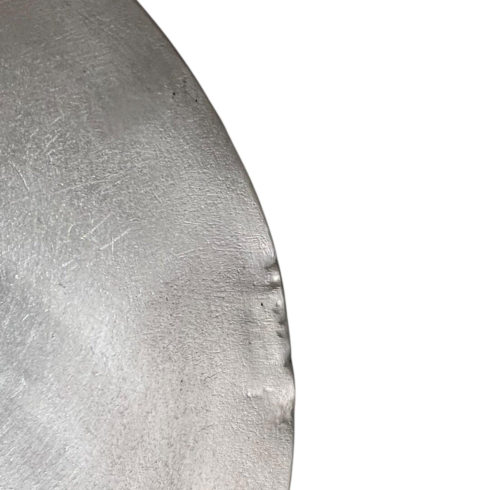 Close up French copper pan lid showing hand wiped traditional new tin lining  on a white background