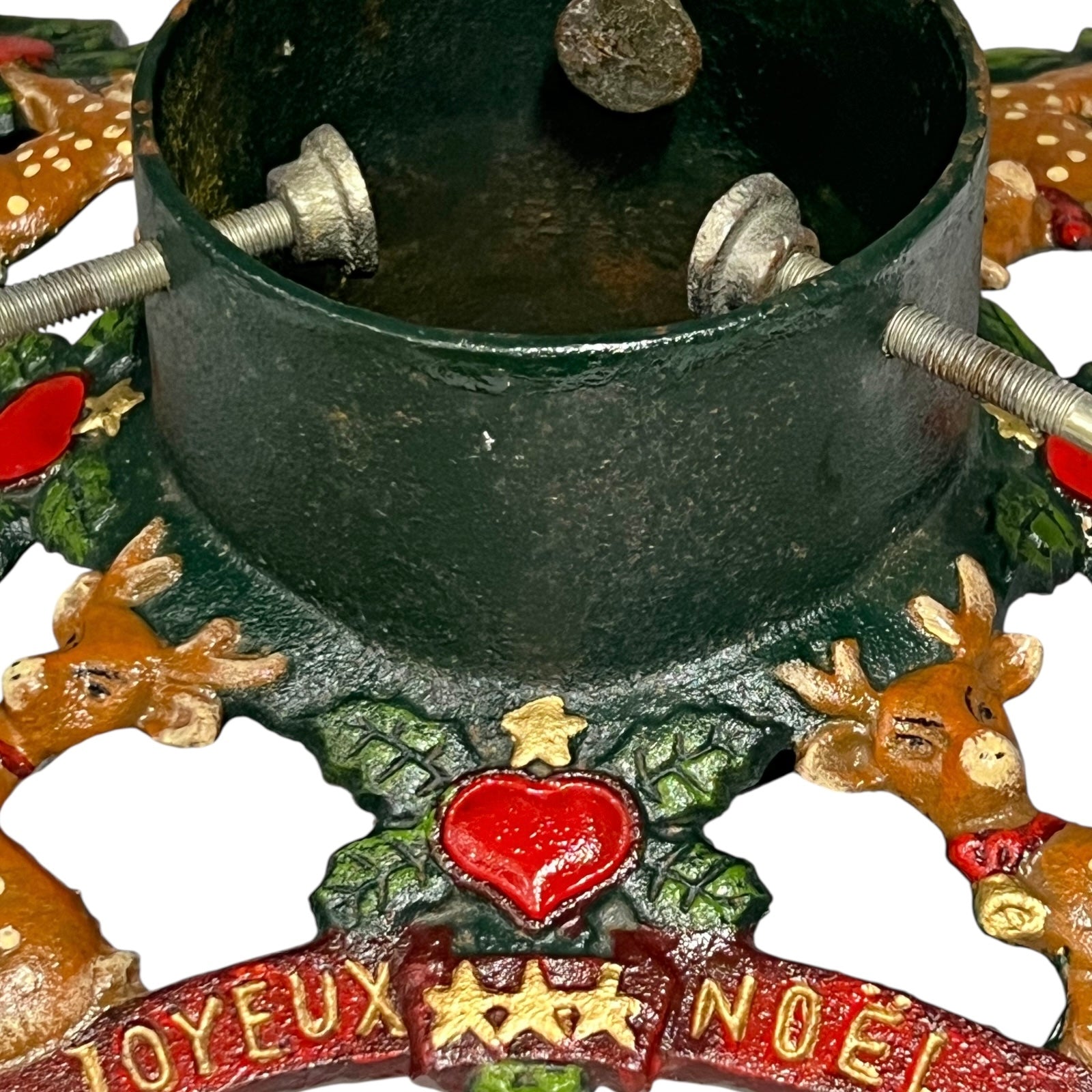 Close up of cast iron Christmas Tree holder on a white background