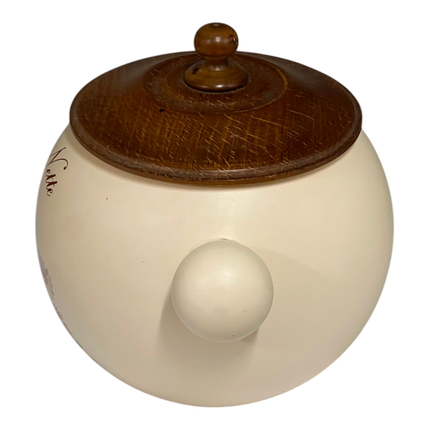 Round ceramic jar with a wooden lid on a white background