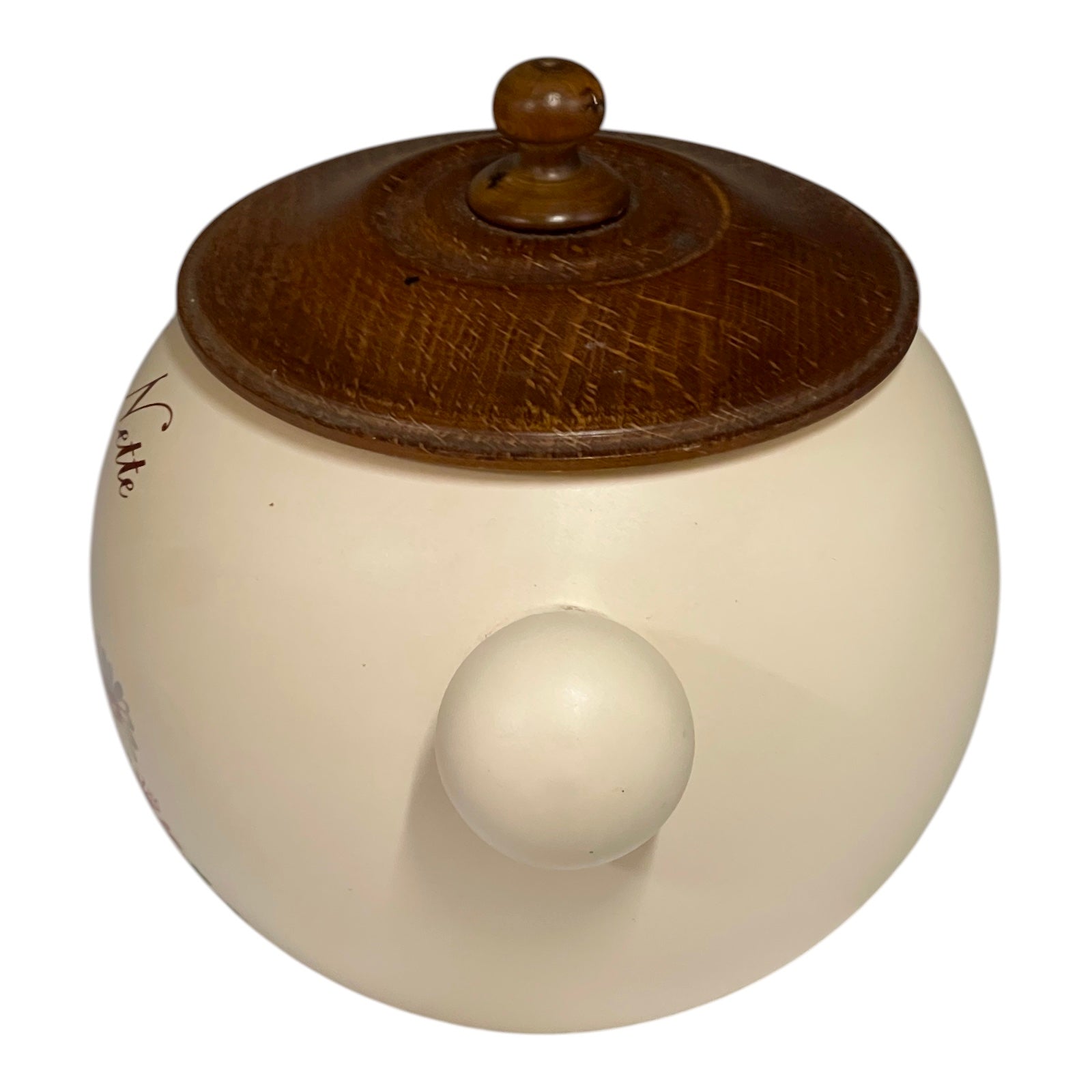 Round ceramic jar with a wooden lid on a white background