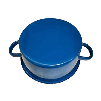 A blue enamel lidded pot with two side handles, shown from a top-down angle on a white background.