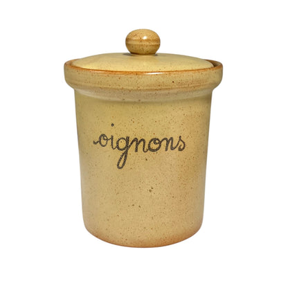 A handmade ceramic canister with a matching lid, featuring a speckled beige and yellow glaze with the word 'oignons' written in black cursive script on the front.