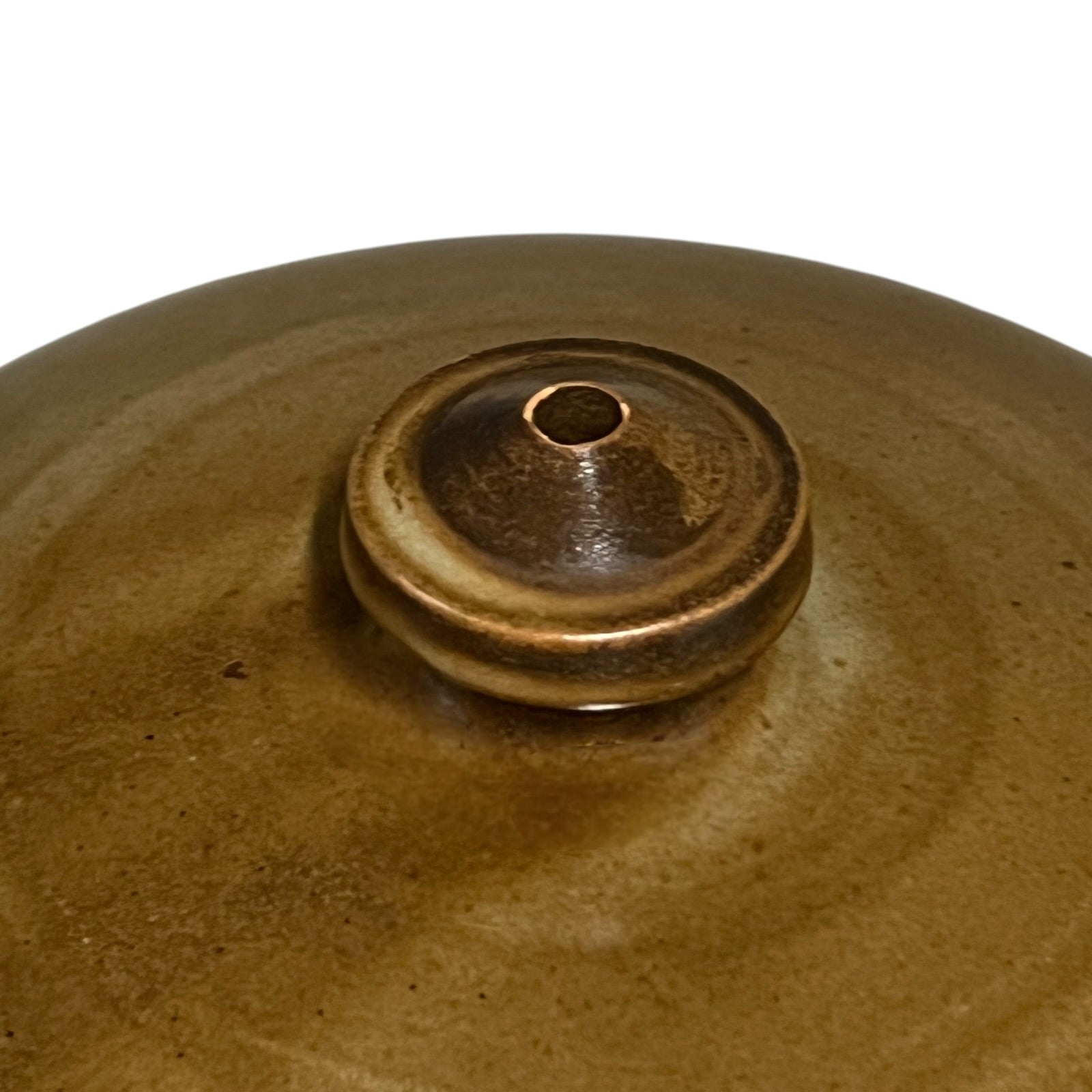 Close-up of a brown ceramic pot on a white background