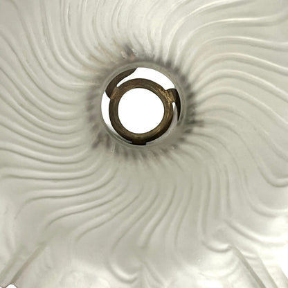 Close up of a glass lampshade on a white background 