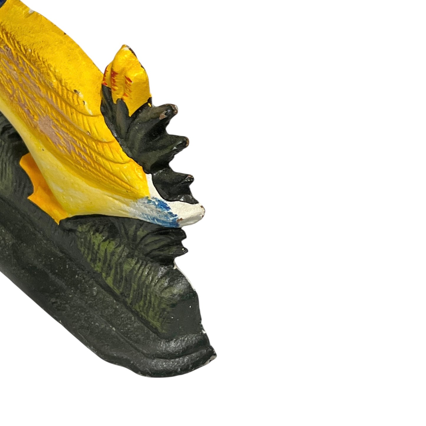 Close up of cast iron doorstop on a white background