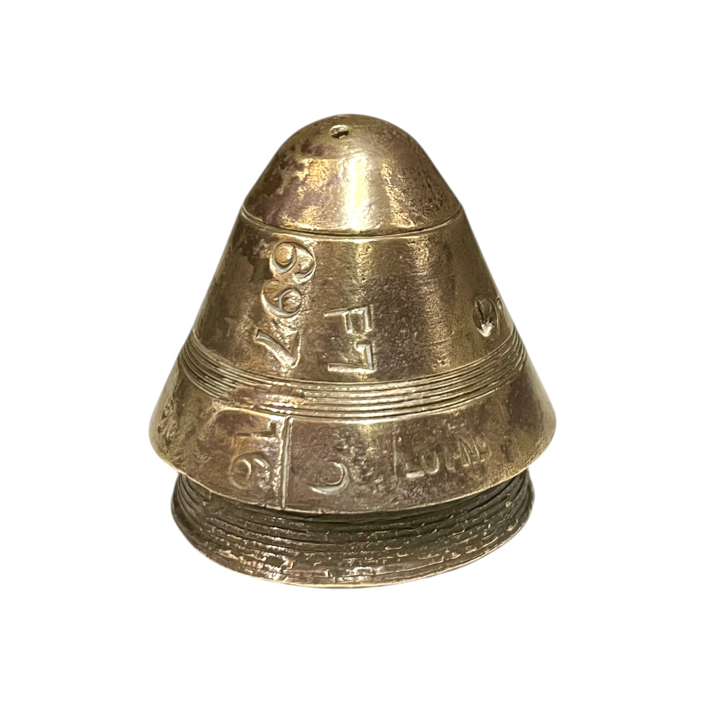 WW1 brass fuse paperweight on a white background