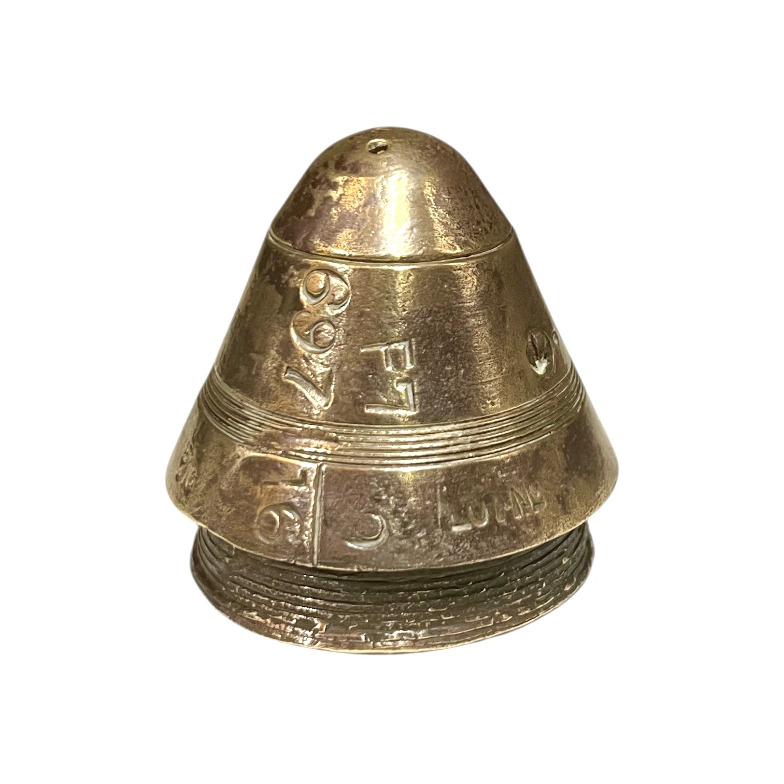 WW1 brass fuse paperweight on a white background