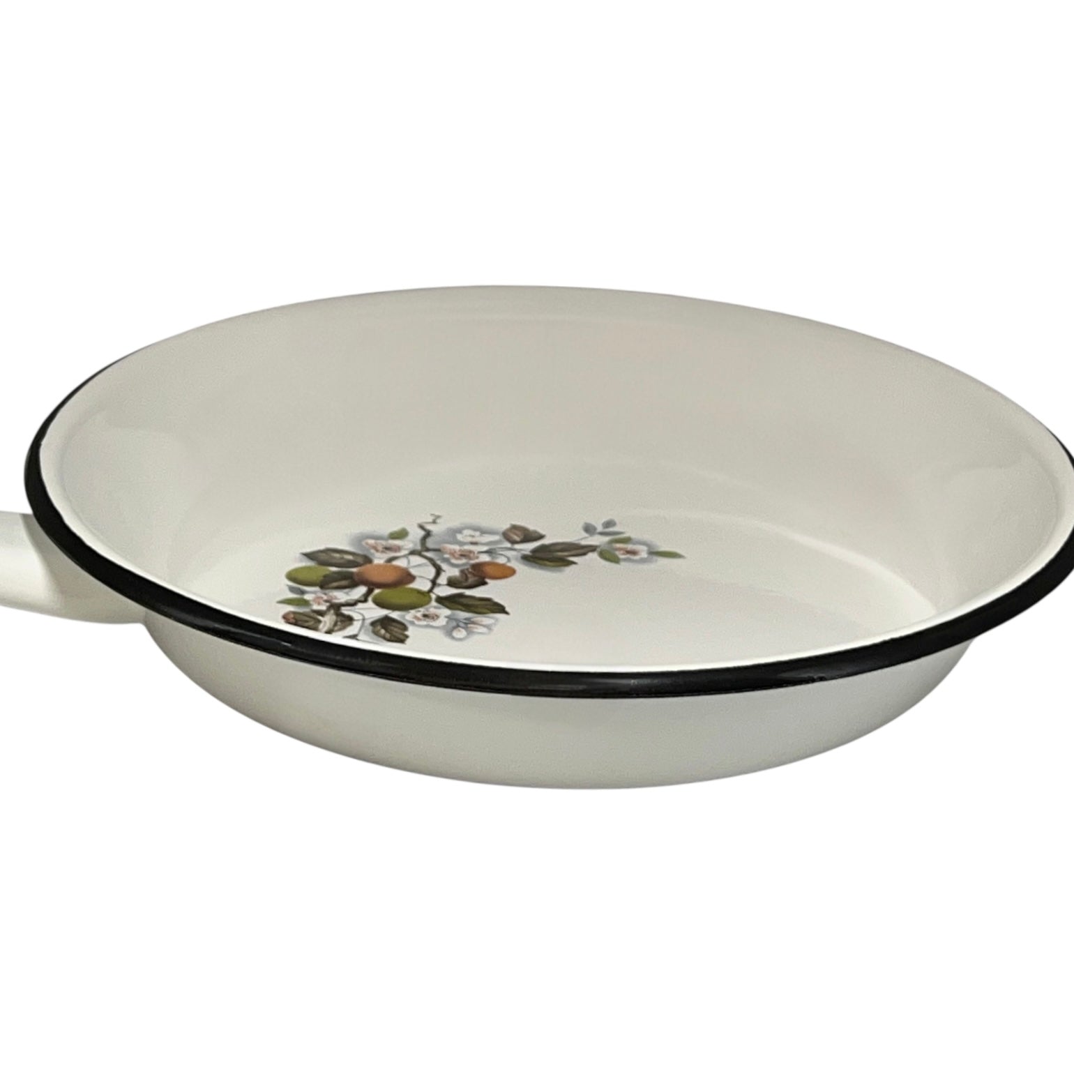 White frying pan with floral design on a white background