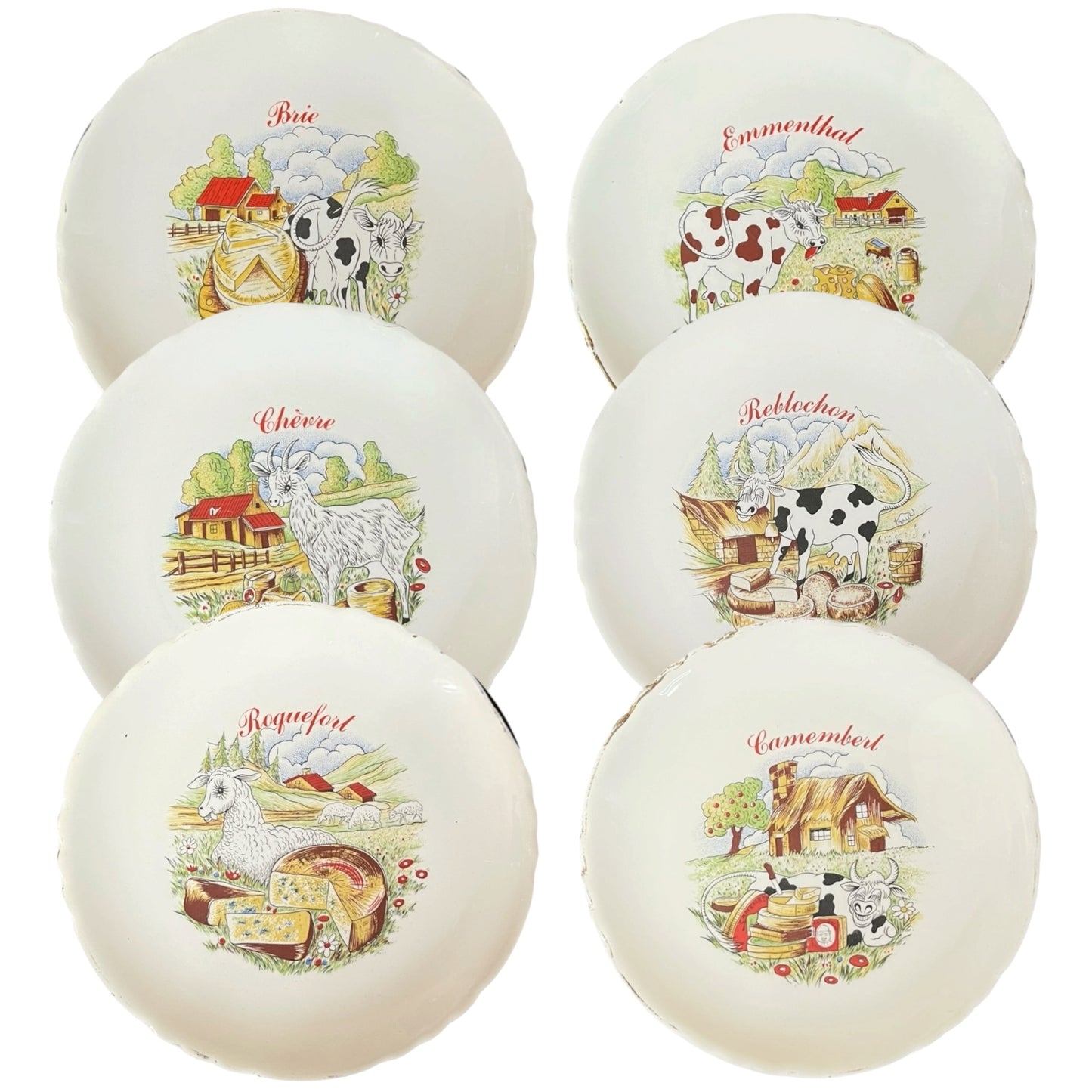 Set of ceramic cheese plates with farm-themed designs on a white background