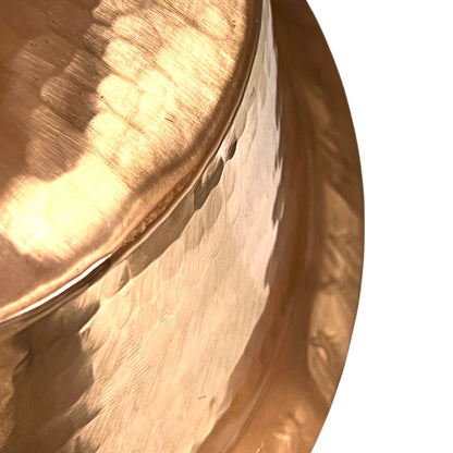 Close-up of a copper sink on a white background