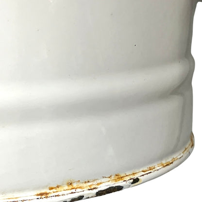 Close up of a vintage enamel lidded white bucket on a white background