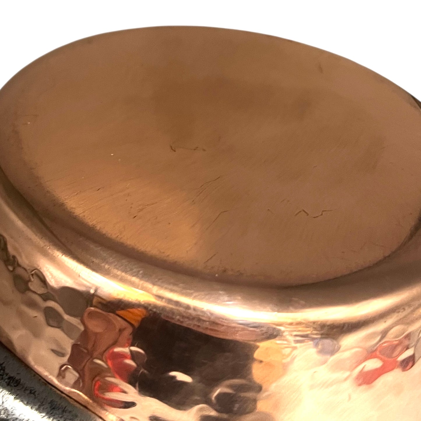 base of copper saucepan 